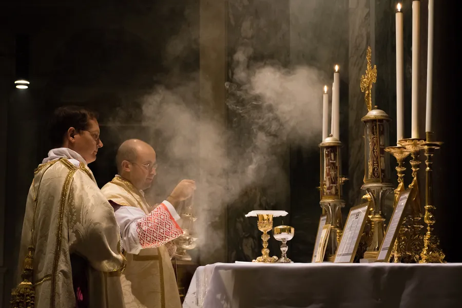Priest celebrating the traditional Latin Mass at the church of St Pancratius, Rome. Thoom/Shutterstock
